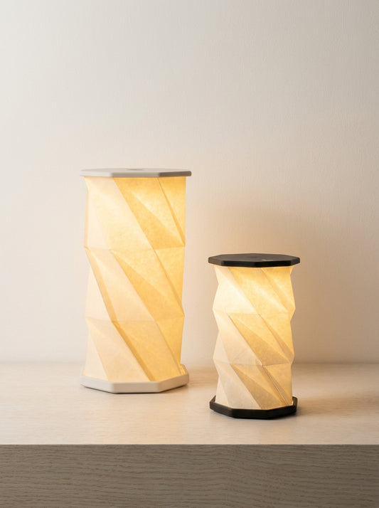 Two decorative lamps with a wavy design on a neutral background