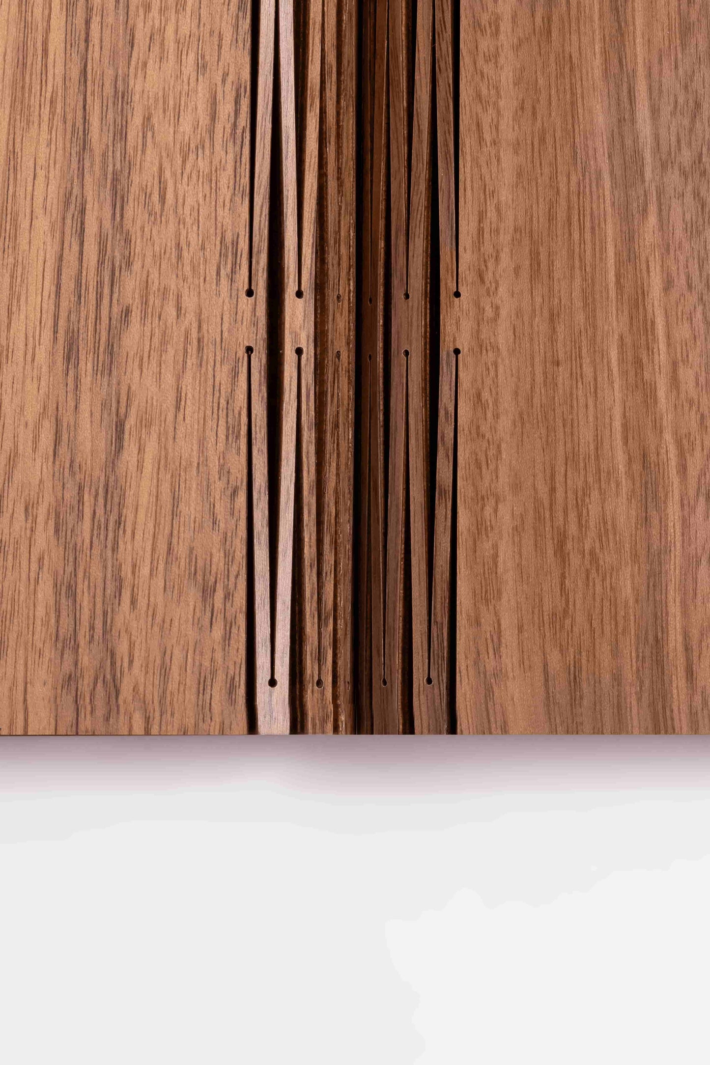 Close-up of wooden panels with a white base